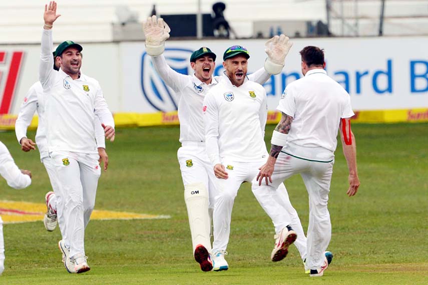 Dale Steyn of the Proteas celebrates the wicket of Martin Guptill of New Zealand with his team mates during day 2 of the 1st Sunfoil International Test match between South Africa and New Zealand at Sahara Stadium Kingsmead in Durban, South Africa on Satur