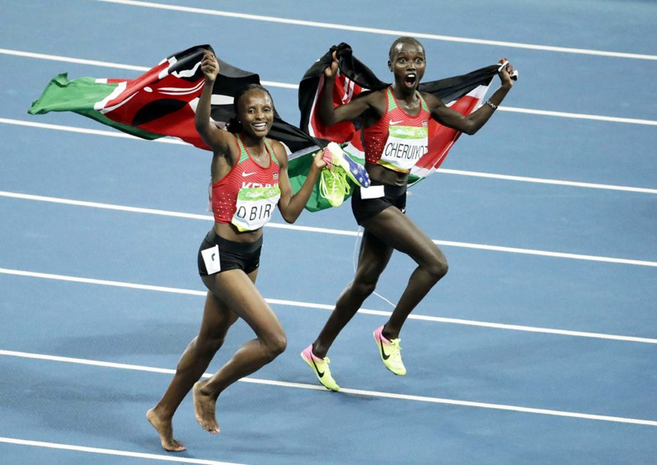 Kenya's gold medal winner Vivian Jepkemoi Cheruiyot, right, and Kenya's Hellen Onsando Obiri celebrate after the women's 5000-meter final, during the athletics competitions at the 2016 Summer Olympics in Rio de Janeiro, Brazil on Friday.
