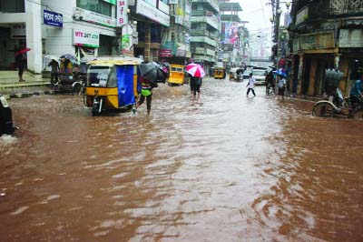 BARISAL: Heavy downpour inundates roads disrupting communication in Barisal city on Sunday.