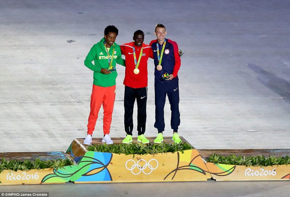 Final medals: Only one event receives its medals at the Summer Games' closing ceremonies - the men's marathon. Kenya's Eliud Kipchoge (center) won gold, Feyisa Lilesa (left) of Ethiopia won silver and American Galen Rupp (right) took bronze.