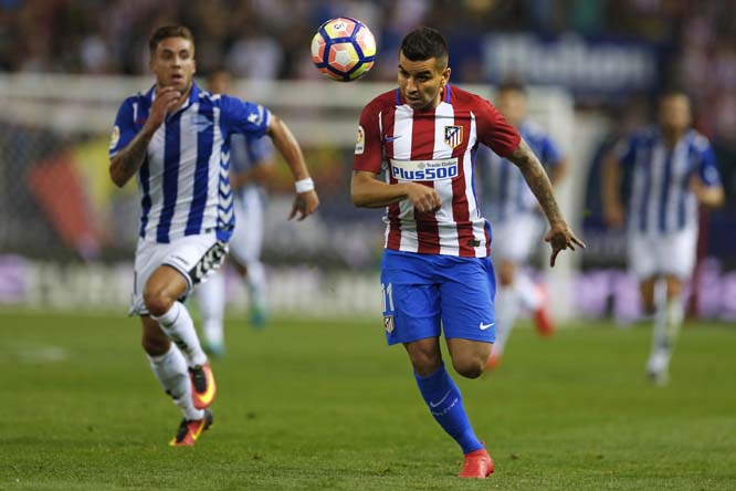 Atletico Madrid's Angel Correa, right, heads the ball as he runs during the Spanish La Liga soccer match between Atletico Madrid and Alaves at the Vicente Calderon stadium in Madrid on Sunday. The match ended in a 1-1 draw.