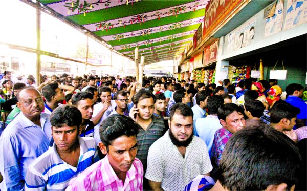 Huge home-goers thronged in front of the bus counters to collect advance tickets for Eid-ul-Azha. This picture was taken from Gabtoli Bus Terminal on Tuesday.