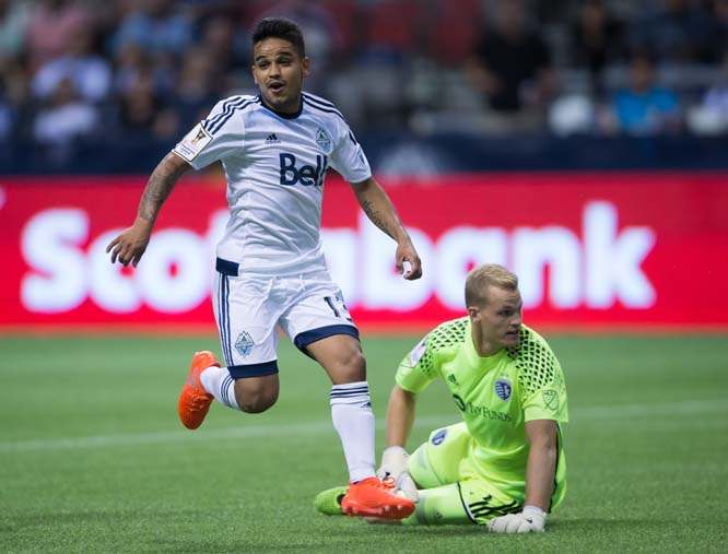 Vancouver Whitecaps' Cristian Techera (left) celebrates his goal against Sporting Kansas City goalkeeper Jon Kempin during the second half of a CONCACAF Champions League soccer match in Vancouver, British Columbia on Tuesday.