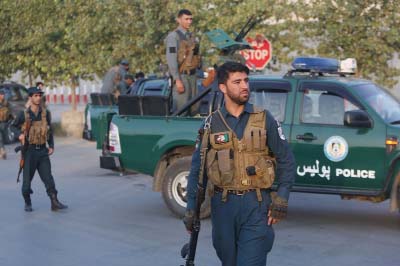 Afghan security forces stand guard after an attack on the American University of Afghanistan in Kabul, Afghanistan on Thursday.