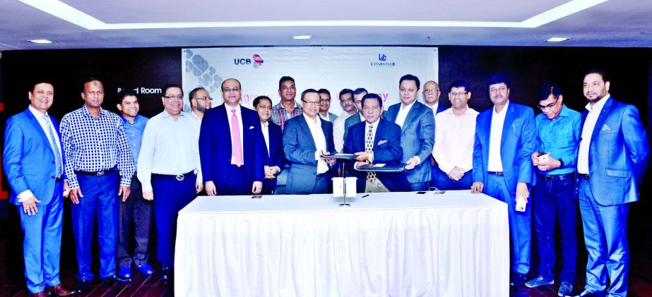 M. A. Sabur, Chairman of UCB and Nasir U. Mahmood, President of Uttara Club along with other guests at the agreement signing ceremony between United Commercial Bank Limited and Uttara Club Limited at the Corporate Office of the bank on Wednesday.