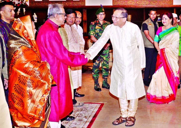 President Abdul Hamid shaking hands with Chief Justice Surendra Kumar Sinha at Bangabhaban on Thursday at a reception organised for the people of the Hindu community on the occasion of Shri Krishna's Janmastami. PID photo