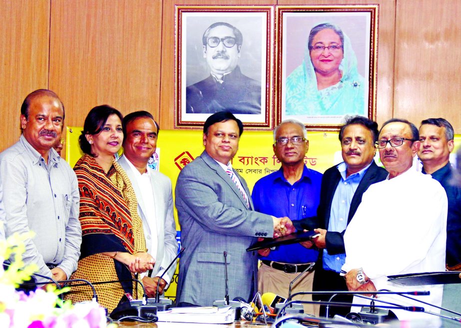Secretary of Ministry of Primary and Mass Education Mohammad Humayun Khalid, Acting Managing Director of Rupali Bank Debasish Chakrabarty and Managing Director of Teletalk Gias Uddin Ahmed sign an MoU for the disbursement of primary stipend through mobile