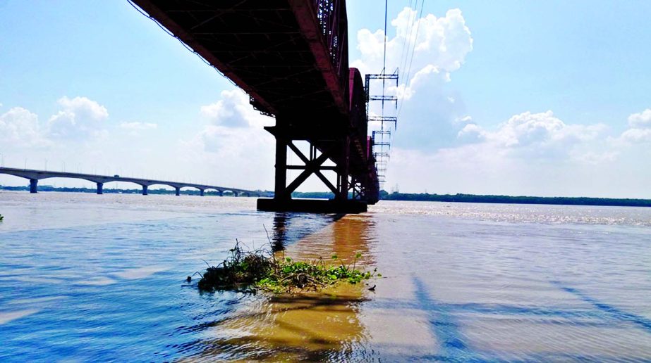 Photo shows flood water in the dry riverbed under Hardinge Bridge as water level in Padma River went up after India opened all the sluice gates of Farakka Barrage. This photo was taken on Saturday.