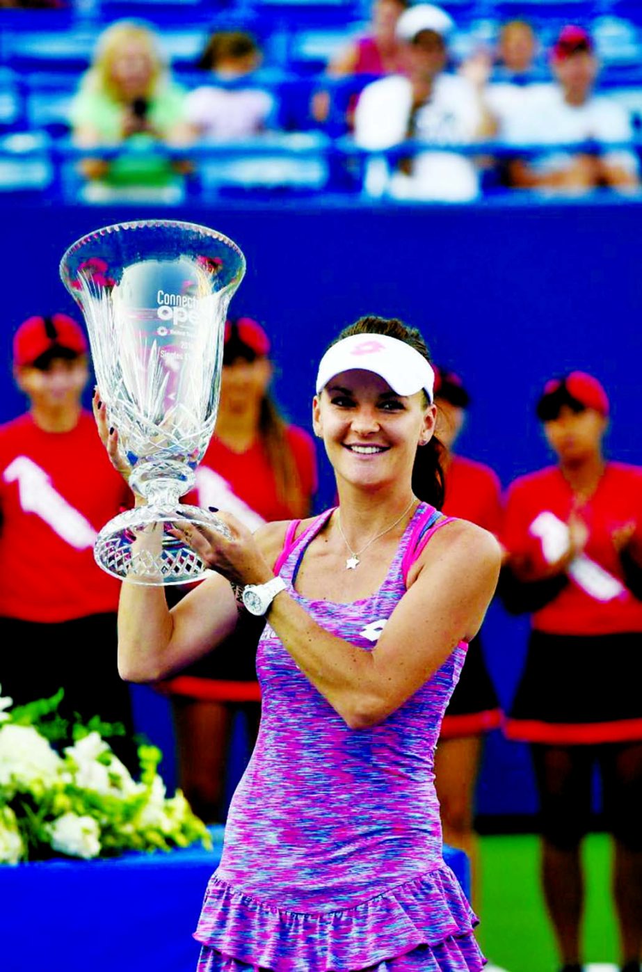 Agnieszka Radwanska of Poland celebrates after defeating Elina Svitolina of Ukraine, 6-1, 7-6 (3) in the final match of the Connecticut Open tennis tournament in New Haven, Conn on Saturday.