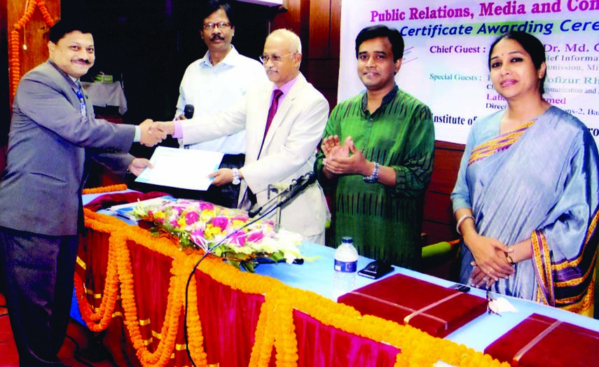 Chief Information Commissioner Prof Dr Golam Rahman distributing certificates among the participants in a training course on 'Public Relations, Media and Communication' organised by Bangladesh Institute of Journalism and Electronics Media at its auditor