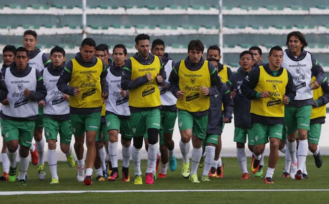 Bolivia's soccer players warm up during a practice session in La Paz, Bolivia on Sunday. Bolivia will face Peru in a 2018 World Cup qualifying soccer game in La Paz, on Sept. 1.