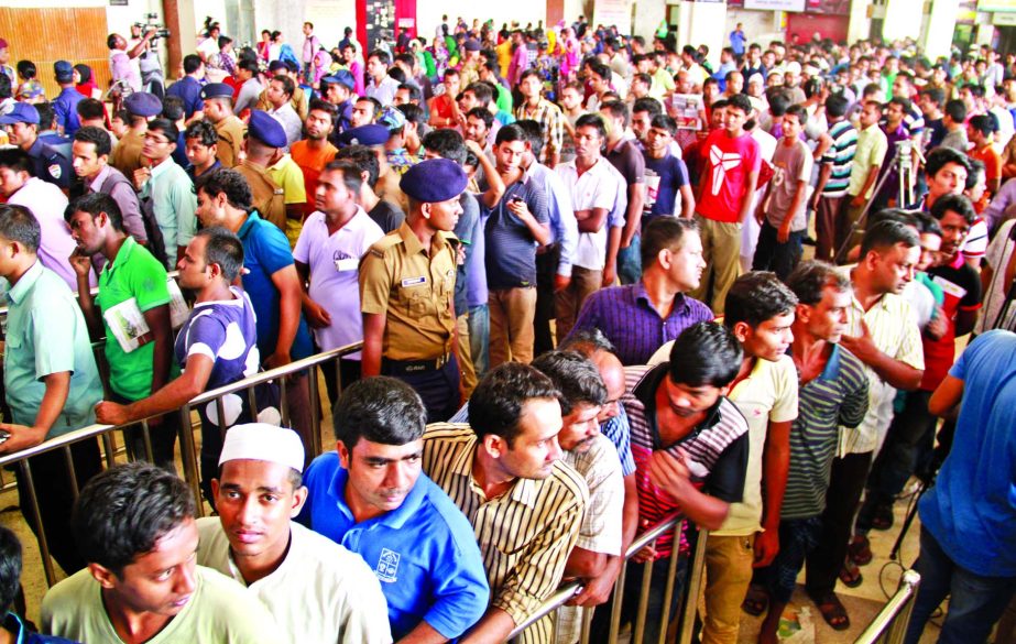 Eid-ul-Azha holidaymakers crowd at the Kamalapur Railway Station counters as advance tickets sale begins on Monday.