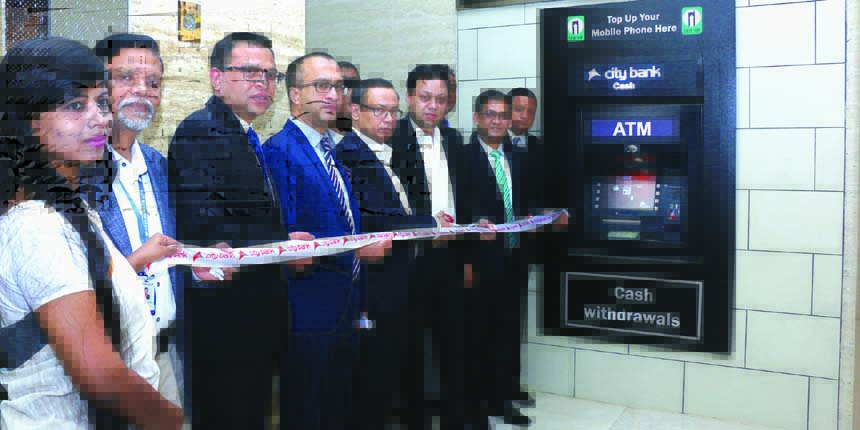 Nasir U. Mahmood, President of Uttara Club and Rubel Aziz, Chairman of City Bank Ltd jointly inaugurating a walk-up ATM with mobile top-up facility at Uttara Club recently.