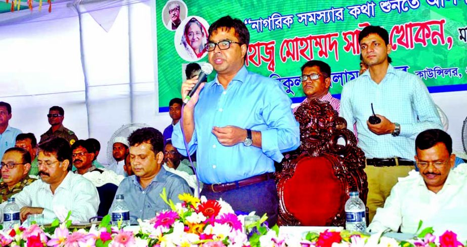 Dhaka South City Corporation Mayor Mohammad Sayeed Khokon hearing the problems of the Ward No 22 at Hajaribagh Community Centre in the city yesterday.