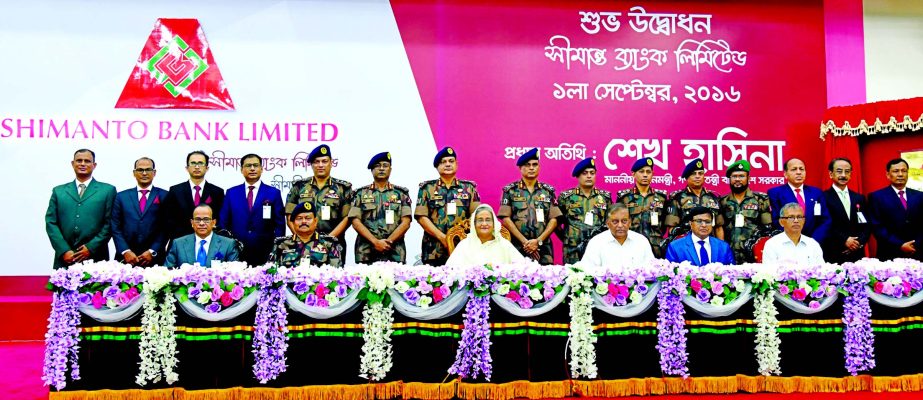 Prime Minister Sheikh Hasina poses at a photo session after inaugurating the Shimanto Bank Ltd at Boarder Guard Bangladesh (BGB) head quarters on Thursday. Officers of the bank and guests are also seen in the photo.