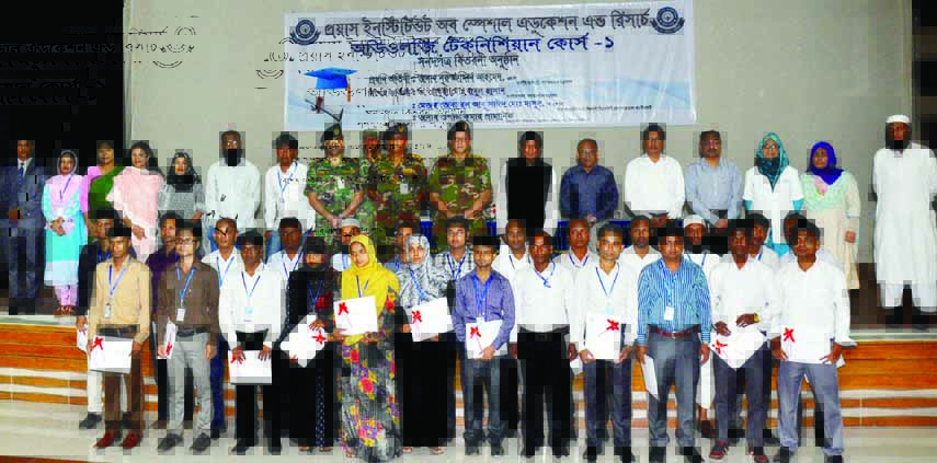 State Minister for Social Welfare Nuruzzaman Ahmed poses for photograph with the trainees of Audiology Technician Course-1 organised by 'Proyash' at Dhaka Cantonment on Thursday.