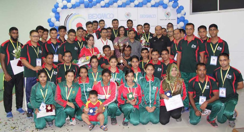 Members of Bangladesh Army team, the champions of the 28th National Shooting Competition with the guests and the officials of Bangladesh Shooting Federation pose for a photo session at Gulshan Shooting Range on Wednesday.