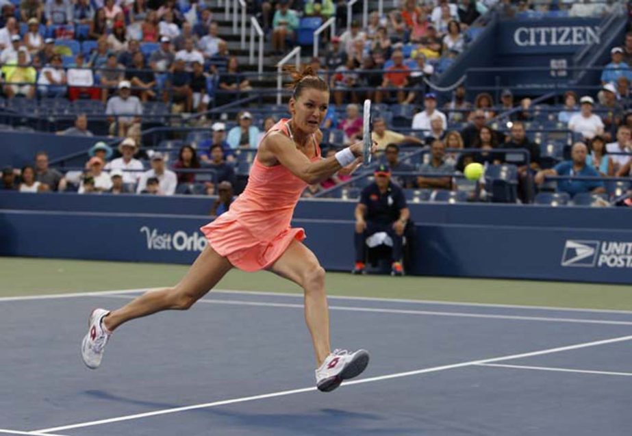Agnieszka Radwanska of Poland, returns a shot to Naomi Broady of the United Kingdom during the second round of the U.S. Open tennis tournament in New York on Thursday.