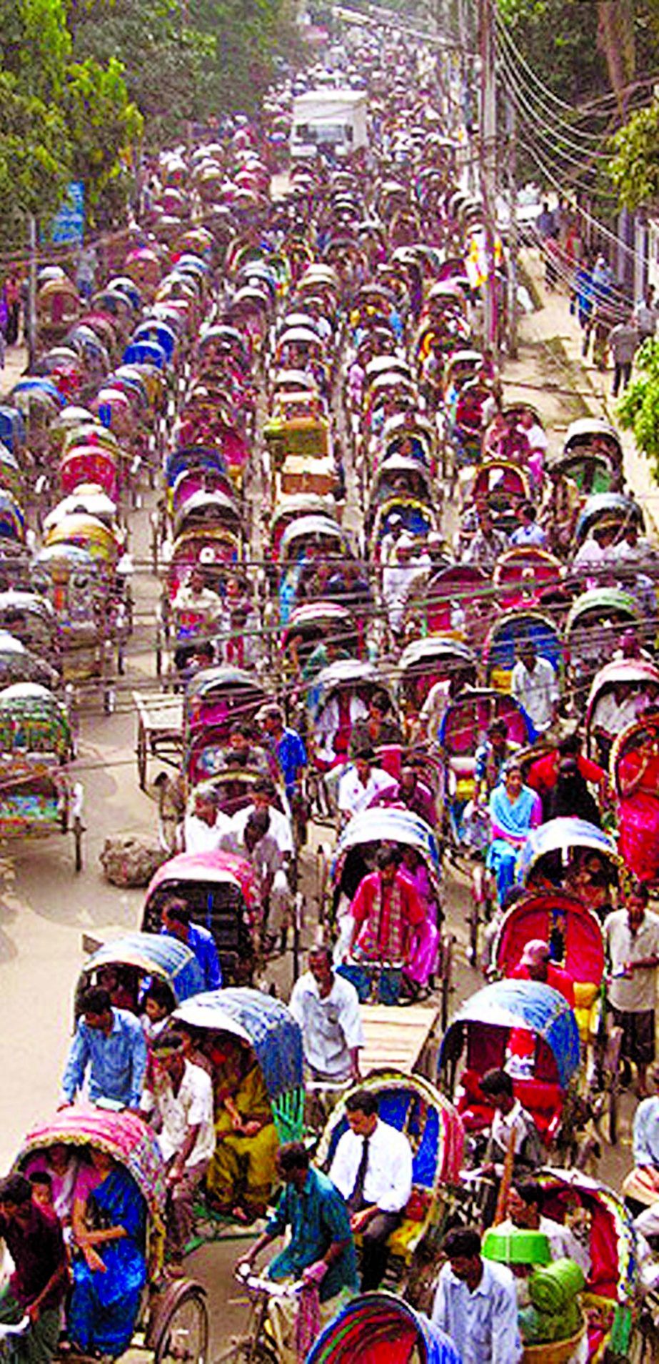 City's Dhanmondi Road No 1 experiencing huge traffic gridlock with most of unlicensed rickshaws stuck up for hours. This photo was taken on Friday.