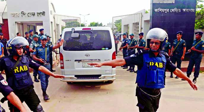 Members of elite force Rapid Action Battalion stand guard on Saturday outside Kashimpur Jail where death row convict war criminal Mir Quasem Ali was awaiting execution.