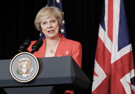 British Prime Minister Theresa May talks to media with U.S. President Barack Obama after their bilateral meeting in Hangzhou in eastern China's Zhejiang province, on Sunday, alongside the G20.