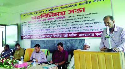 SYLHET: A S M Abdul Ouadud, District Education Officer, Moulvibazar speaking at a view exchange meeting on child marriage, militancy and terrorism organised by Gousal Azam Abdul Ulaia Sunni Dakhil Madrasa at Boraiuri village on Saturday.