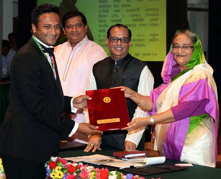Prime Minister Sheikh Hasina handing over the National Sports Award 2012 to Shakib Al Hasan at the Osmani Memorial Auditorium in the city on Sunday.