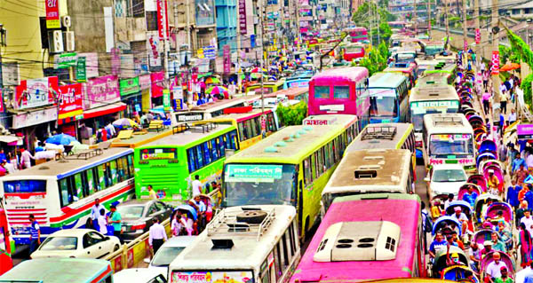 City started experiencing traffic jam ahead of Eid-ul-Azha because of setting up cattle markets in various areas causing sufferings to commuters and pedestrians This photo was taken from Paltan area on Sunday.