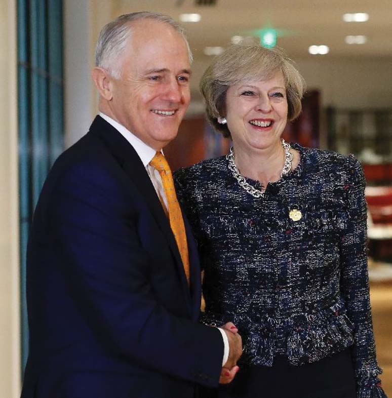 British Prime Minister Theresa May shakes hands with Australian Prime Minister Malcolm Turnbull during a bilateral meeting on the sidelines of G20 Summit in Hangzhou, China on Monday.