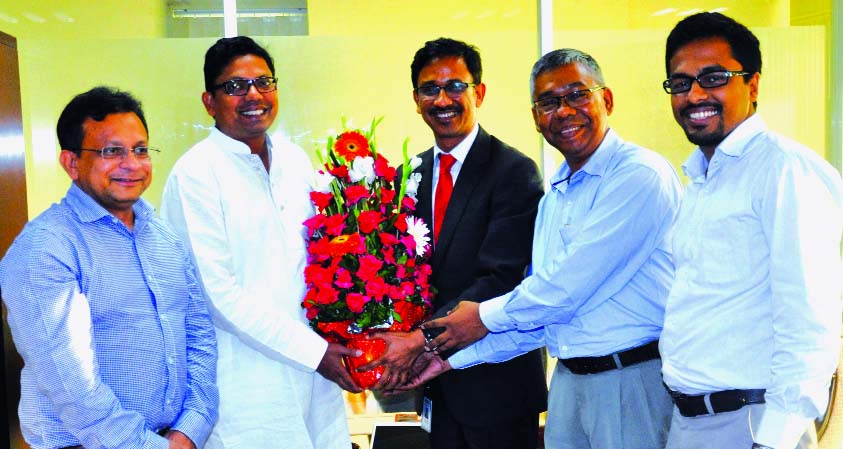 Arif Khan, FCMA, President of the Institute of Cost and Management Accounts of Bangladesh (ICMAB) presents a flower bouquet to the ICT State Minister Zunaid Ahmed Palak, MP at the Minister's office on Sunday. ICMAB leaders called on the Minister to disc