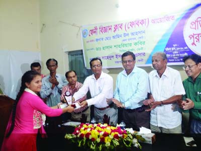 FENI: The prize-giving ceremony of essay competition of Feni Science Club was held on Sunday. A winner is seen receiving certificate from the guests of the function.