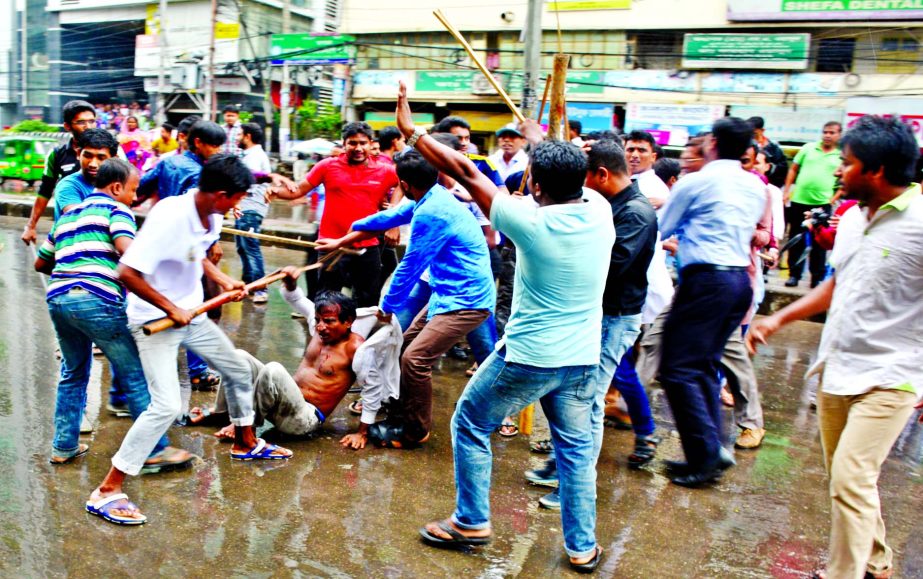 BNP activists those claimed as 'Ashol' BNP were beaten up by 'Nakol' BNP in front of its Naya Paltan Central Office on Monday.