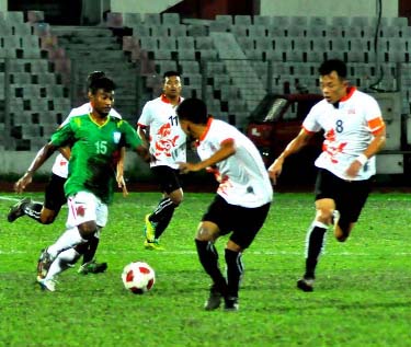 A moment of the AFC Asian Cup Qualifiers play-off match between Bangladesh National Football team and Bhutan National Football team at the Bangabandhu National Stadium on Tuesday. The match ended in a goalless draw.