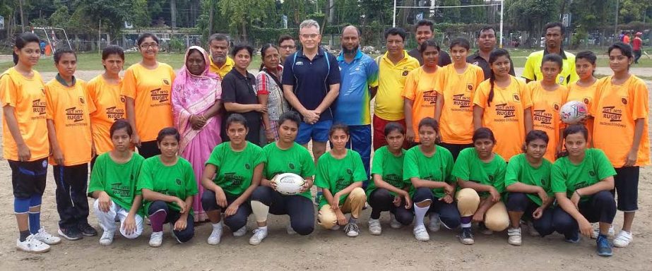 Advisor of Asia Rugby Strategic Development Matthew Oakley and Bangladesh Under-18 Girls' Rugby team pose for photograph at the Paltan Maidan on Tuesday.