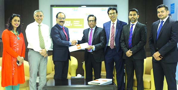Shafiqul Alam, Managing Director of Jamuna Bank Limited and Sudesh Giriyan, Chief Operating Officer of Xpress Money Services, UAE, exchanging documents of a deal on "Disbursement of Foreign Remittance through Jamuna Bank Limited as Principal Agent" at U