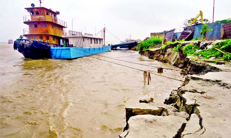 With the pontoon delinked from landing station due to rising water, ferries at Daulatdia turned inoperative causing disruption in the movement of cattle-laden truck ahead of Eid. This photo was taken from Daulatdia ghat on Wednesday.