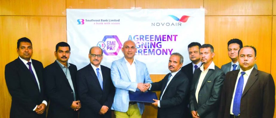 SM Mainuddin Chowdhury, Additional Managing Director of Southeast Bank Ltd (SEBL) and Sohail Majid, Head of Marketing & Sales of NOVOAIR Ltd, shaking hands after signing an agreement on Thursday in the city. Under the deal, SEBL Credit Cardholders can ava