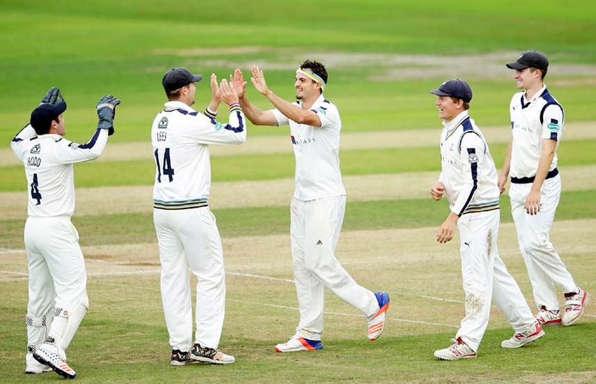 Jack Brooks celebrates one of his four wickets on 3rd day of Division One in the County Championship between Yorkshire and Durham in Headingley on Thursday.