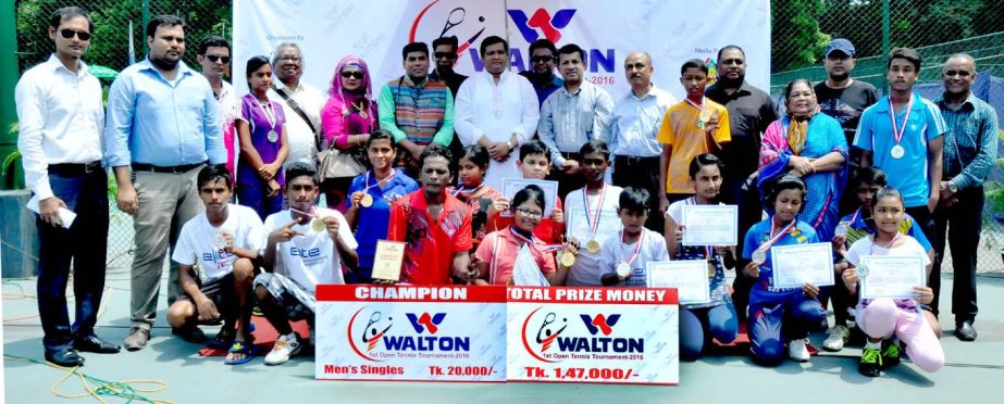 The winners of the Walton 1st Open Tennis Competition with the guests and the officials of Bangladesh Tennis Federation pose for photograph at the National Tennis Complex in Ramna on Thursday.