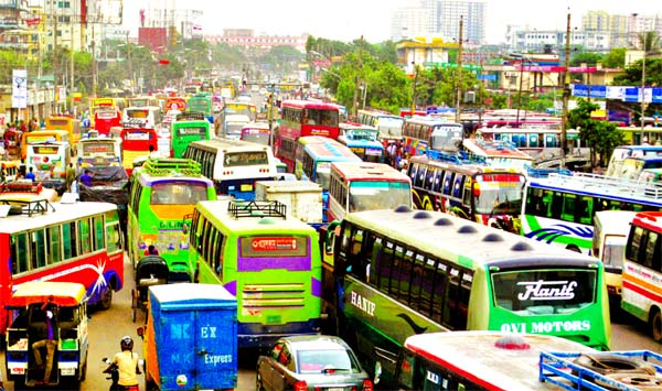 Huge traffic chaos from Gabtali to Jamuna Bridge via Savar crippled life in city and elsewhere also ahead of Eid. This photo was taken from Amin Bazar Bridge area on Thursday.