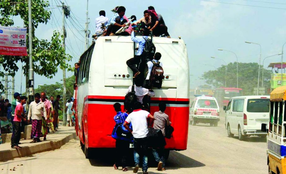 Home-bound passengers going to their respective destination to meet their near and dear ones on the occasion of holy Eid-ul-Azha riding on the roof of a bus risking their lives. The snap was taken from the city's Gabtoli Bus Terminal on Friday.