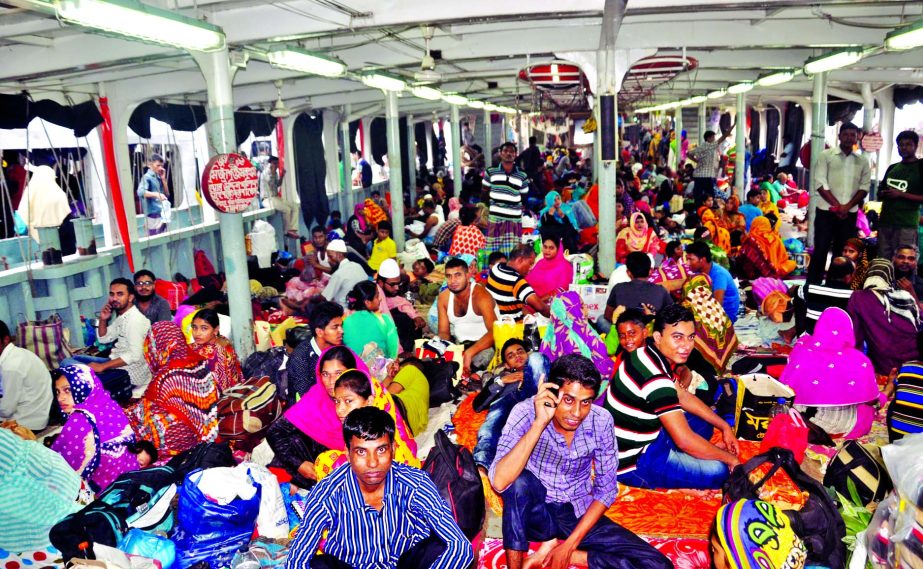 Thousands of home-goers waiting at Sadarghat launch terminal to reach their respective destinations for celebrating Eid-ul-Azha with their near and dear ones on Friday.