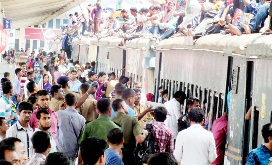 People in Chittagong are sitting on the roof of a train to leave the city ahead of Eid. This picture was taken from Chittagong Rail Station on Friday.