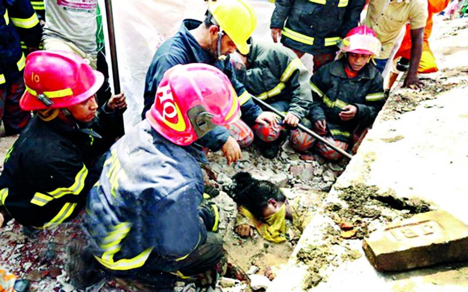 Fire fighters continue their efforts to recover the workers from under the rubble of Tongi boiler exploded collapsed building on Saturday.