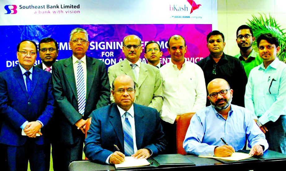 Shahid Hossain, Managing Director of Southeast Bank Ltd and Kamal Quadir, Chief Executive Officer of bKash Ltd, sign an agreement to provide payment and collection service to bKash distributors through the bank's branches network at bank's head office r