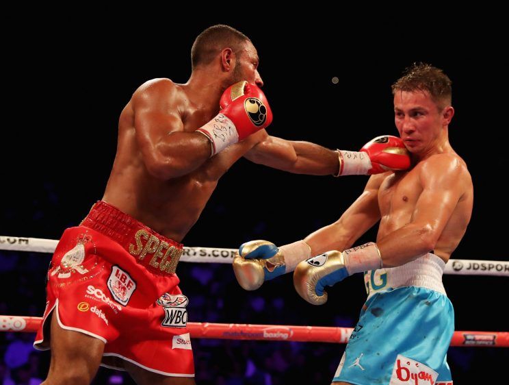 Kell Brook (L) fires a left hand at Gennady Golovkin during their middleweight title fight in London on Saturday. Golovkin won by fifth-round stoppage.