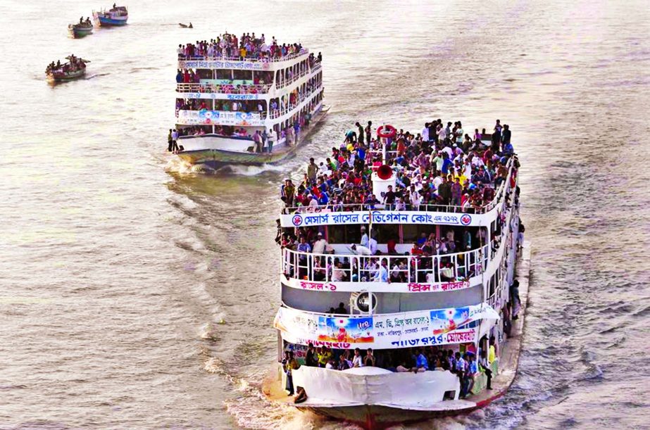 Over-crowded Launches leaving Sadarghat at terminal on Buriganga River carrying home bound passengers on roof top to celebrate Eid-ul-Azha risking life and defying BIWTA embargo. This photo was taken from Postogola area on Sunday.