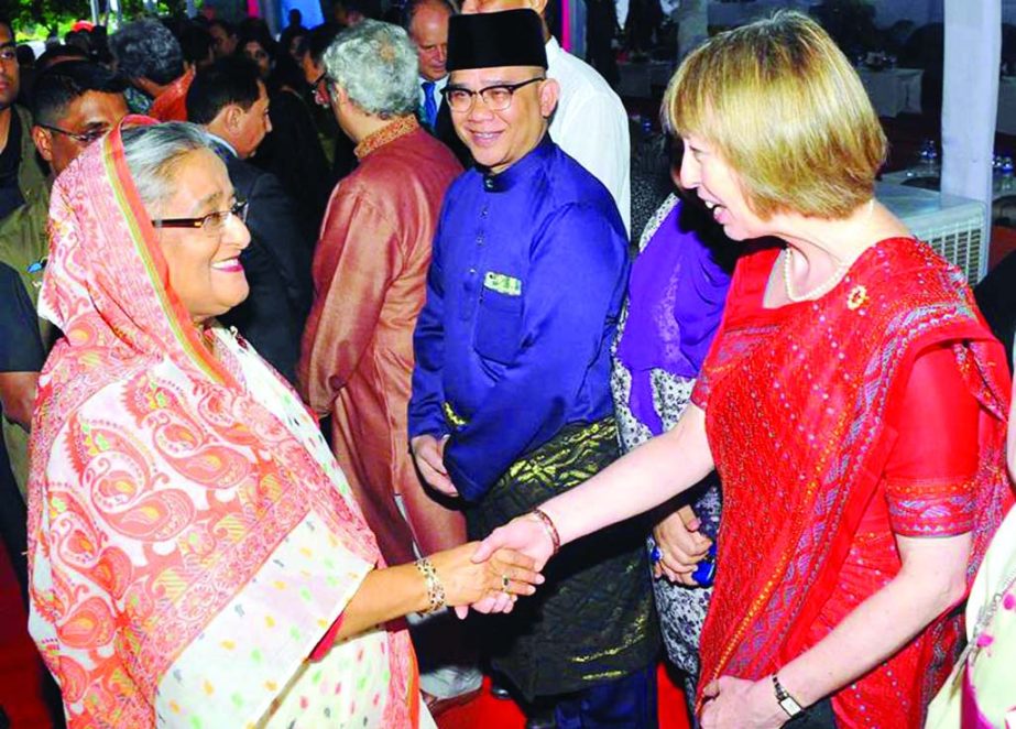 Prime Minister Sheikh Hasina exchanging Eid greetings to people from all walks of life including diplomats at Ganabhaban on Tuesday.
