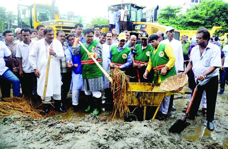 Dhaka South City Corporation Mayor Mohammad Sayeed Khokon inaugurating wastes removal works of sacrificial animals at Dolai Khal area in the city on Tuesday.