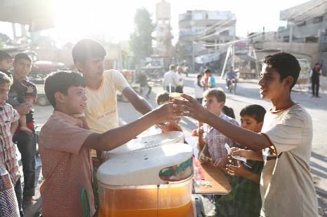 Syrians welcomed the lull in fighting as they celebrated the Eid al-Adha festival in the rebel-controlled town of Hamouri, on the outskirts of Damascus, on Wednesday.